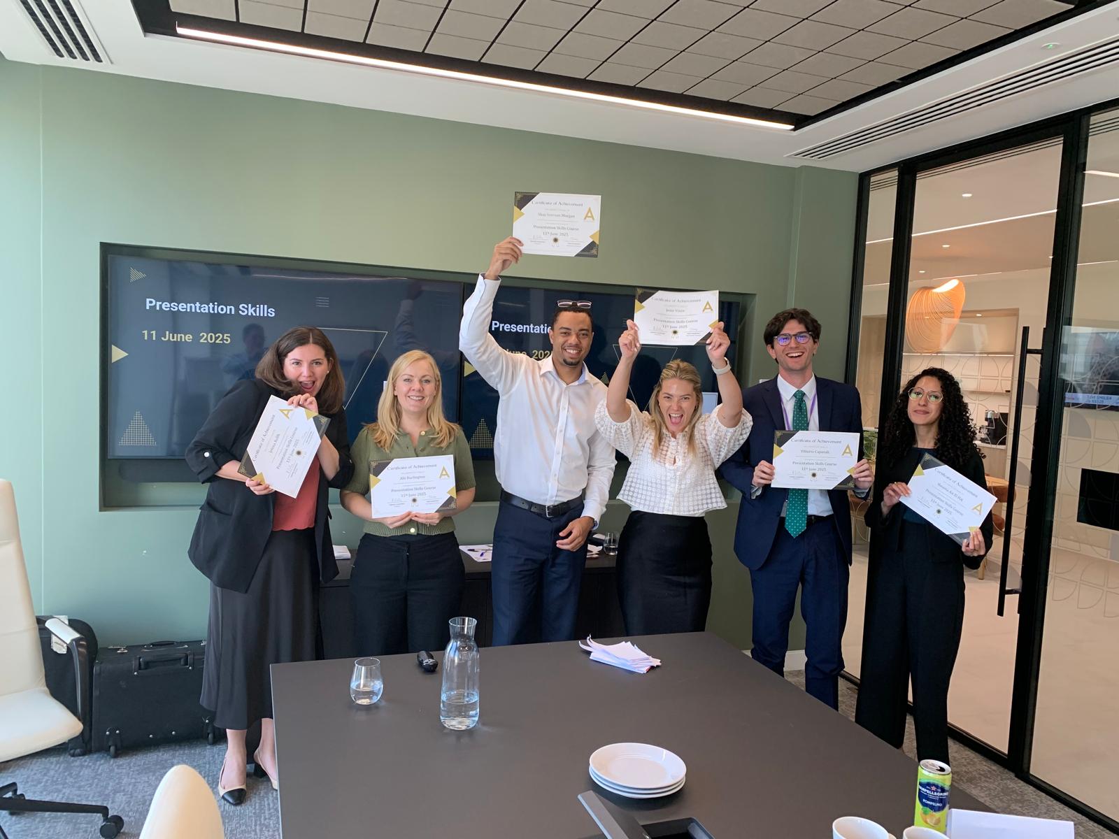 Allspring delegates proudly displaying CPD certificates after Asset Training Academy course completion